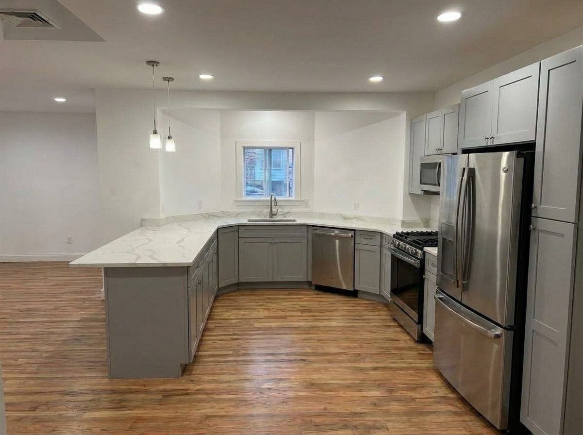 White shaker kitchen with stainless appliances
